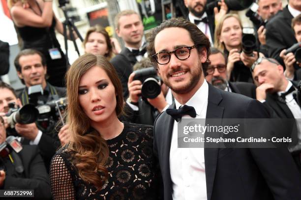 Emilie Broussouloux and Thomas Hollande attend the "Amant Double " premiere during the 70th annual Cannes Film Festival at Palais des Festivals on...