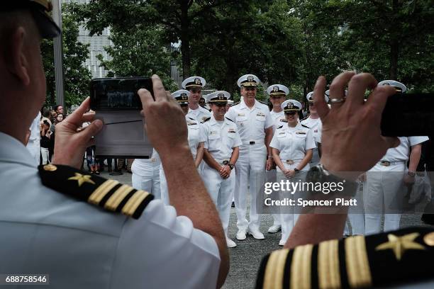 Members of the U.S. Navy and Coast Guard participate in a military re-enlistment and promotion ceremony outside of the 9-11 Memorial on May 26, 2017...