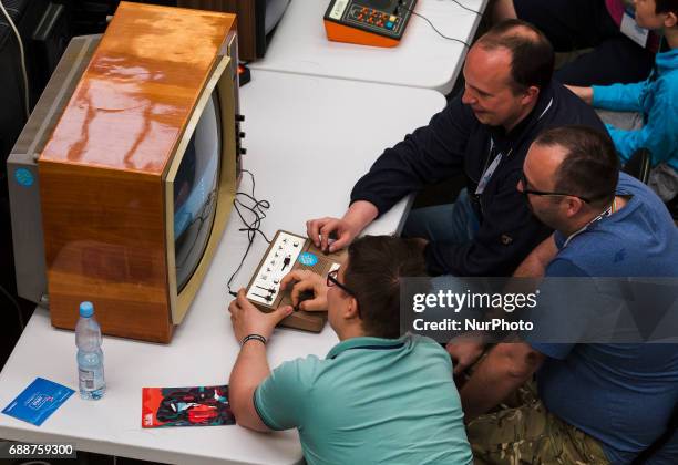 People play oldschool video games on Pixel Heaven fair in Warsaw, 26 May Poland