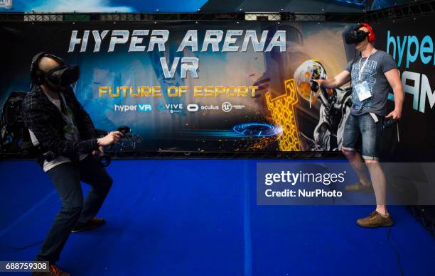 Two man in virtual reality glasses on Pixel Heaven fair in Warsaw, 26 May Poland