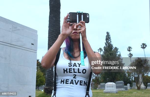 Soundgarden fan Melody Andrade, wearing a "Say Hello 2 Heaven" t-shirt, attends the funeral service for Soundgarden frontman Chris Cornell on May 26,...