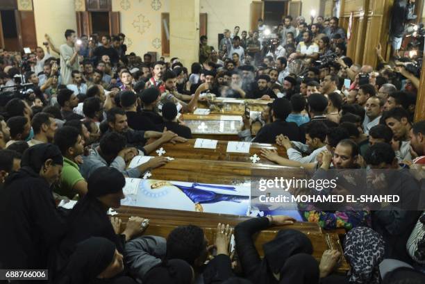 Coptic Rip Relatives of killed Coptic Christians grieve by the coffins during ...