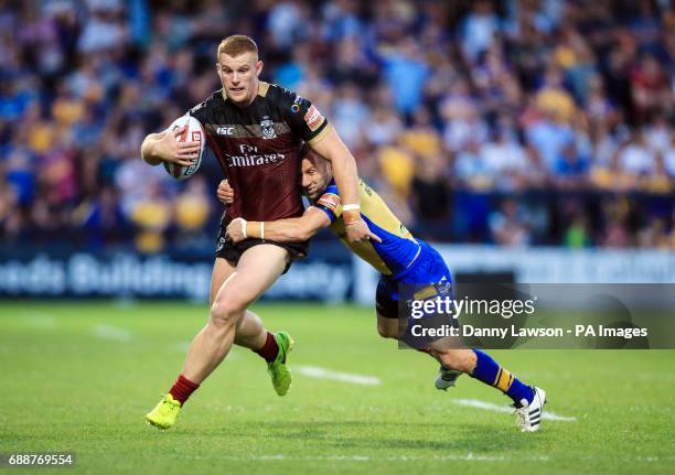 Warrington Wolves' Jack Hughes breaks through the Leed's line during the Betfred Super League match at Headingley Stadium, Leeds.