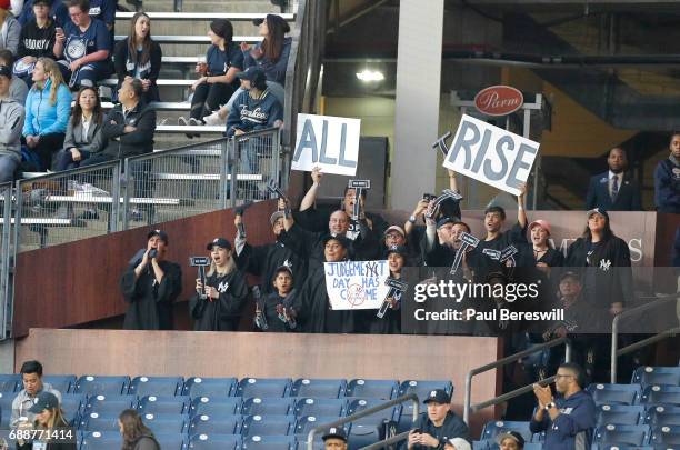 Fans cheer in the Judge's Chambers in right field at Yankee Stadium when Aaron Judge of the New York Yankees comes up to bat in an MLB baseball game...