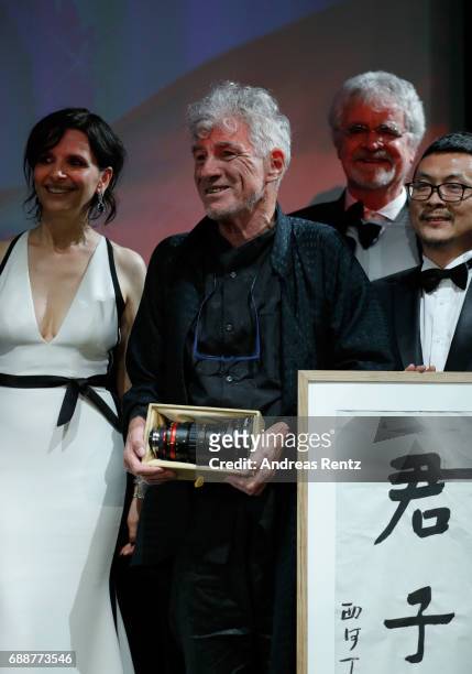 Director Christopher Doyle accepts the "Pierre Angenieux ExcelLens in Cinematography" award onstage at the Tribute to Christopher Doyle during the...