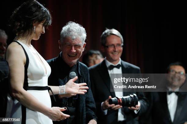 Juliette Binoche is seen on stage while Director Christopher Doyle accepts the "Pierre Angenieux ExcelLens in Cinematography" award onstage at the...