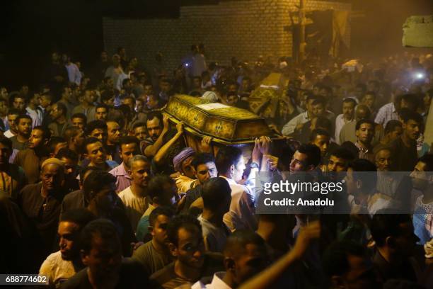 People attend the funeral ceremony held for eight victims of the Saint Samuel's Monastery attack in Egypts southern Minya province, Cairo, Egypt on...