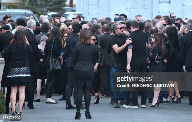 Condolences and hugs are offered following a service at the funeral for Soundgarden frontman Chris Cornell on May 26, 2017 at the Hollywood Forever...