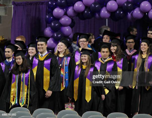 Kristina Washer processes into the DCU Center at the beginning of the 2017 commencement exercises at the College of The Holy Cross with her fellow...