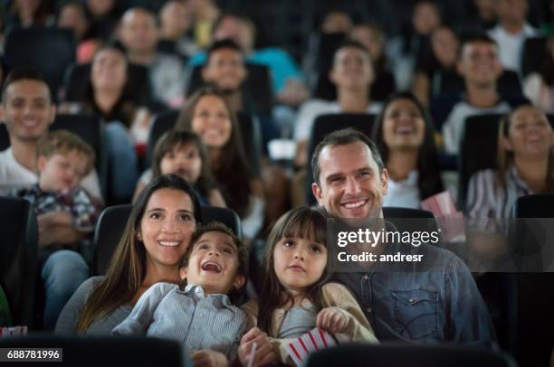 portrait of a happy family having fun at the cinema - children theatre imagens e fotografias de stock