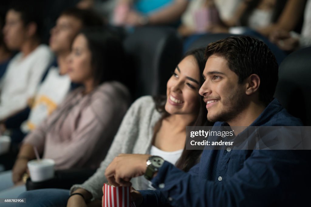 Couple watching a movie at the cinema