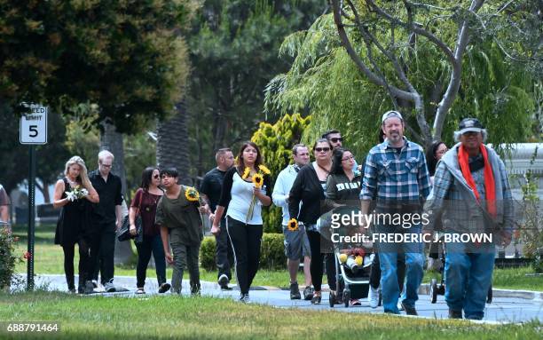 Fans arrive at the Hollywood Forever Cemetery to visit the grave of Soundgarden frontman Chris Cornell who was buried here at a funeral service...
