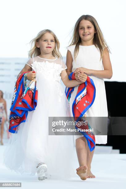 Luna De La Rosa and Katie Irvine walk the runway during the Amber Lounge 2017 at on May 26, 2017 in Monaco, Monaco.