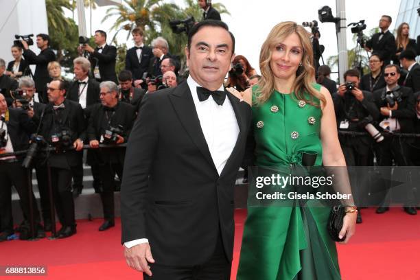 Renault CEO Carlos Ghosn and his wife Carole Ghosn attend "Amant Double " Red Carpet Arrivals during the 70th annual Cannes Film Festival at Palais...