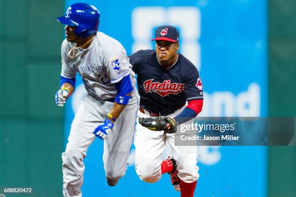 Jose Ramirez of the Cleveland Indians runs down Alcides Escobar of the Kansas City Royals to end the top of the seventh inning at Progressive Field...