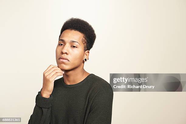 portrait of young man - confused white background stock-fotos und bilder