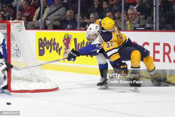 Defenceman Jakub Zboril of the Saint John Sea Dogs moves the puck against forward Warren Foegele of the Erie Otters on May 26, 2017 during the...