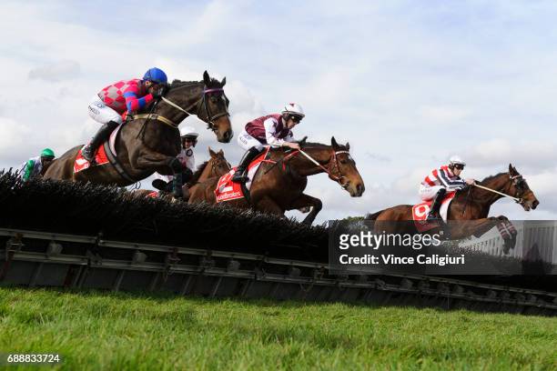 John Allen riding Renew jumping before winning Race 4, The Australian Hurdle during Melbourne Racing at Sandown Lakeside on May 27, 2017 in...