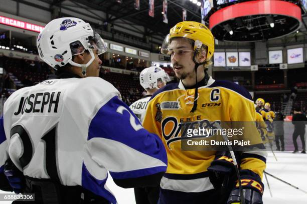 Forward Dylan Strome of the Erie Otters shakes hands with forward Mathieu Joseph of the Saint John Sea Dogs after a 6-3 Erie win on May 26, 2017...