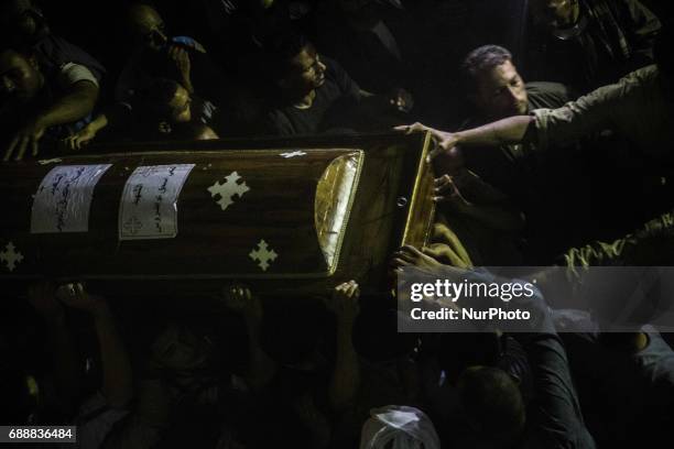 Funeral service of Christians who were killed during a bus attack, at Abu Garnous Cathedral in Minya, Egypt, Friday, May 26, 2017. Egyptian security...