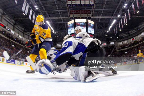 Forward Dylan Strome of the Erie Otters moves the puck against goaltender Callum Booth of the Saint John Sea Dogs on May 26, 2017 during the...