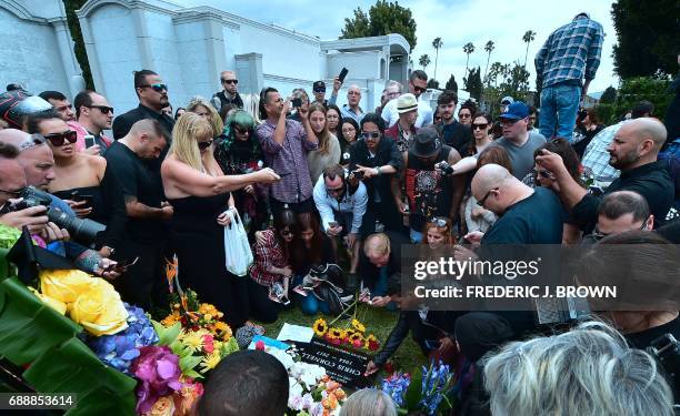 Fans visit the grave of Chris Cornell at Hollywood Forever Cemetery following a funeral service earlier in the day for the Soundgarden frontman on...