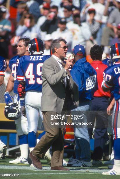 Head Coach Dan Reeves of the New York Giants looks on from the sidelines against the Washington Redskins during an NFL football game October 10, 1993...
