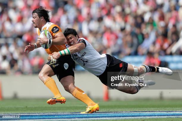 Harumichi Tatekawa of the Sunwolves tackles Clinton Swart of the Cheetahs during the Super Rugby Rd 14 match between Sunwolves and Cheetahs at Prince...