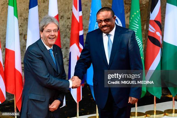 Italian Prime Minister Paolo Gentiloni welcomes Ethiopian Prime Minister Hailemariam Desalegn as he arrives at the Hotel San Domenico on the second...