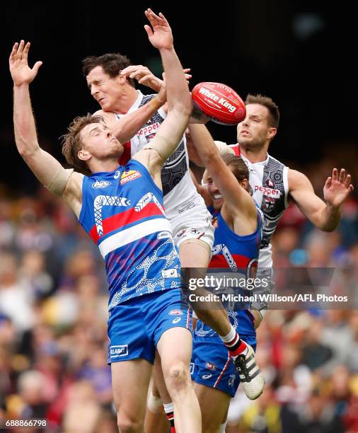Jordan Roughead of the Bulldogs, Jake Carlisle of the Saints, Marcus Bontempelli of the Bulldogs and Nathan Brown of the Saints compete for the ball...