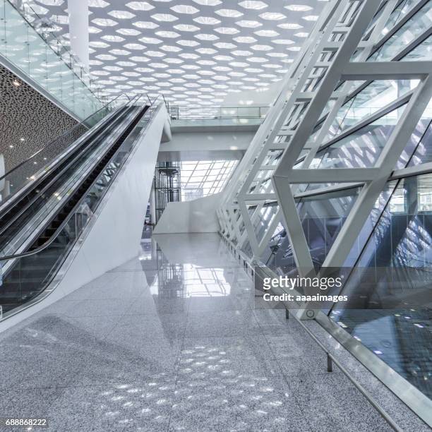 low angle view of empty escalator at airport - airport stairs stock pictures, royalty-free photos & images
