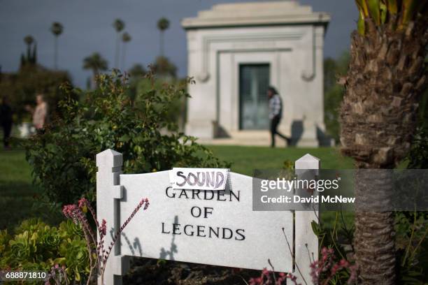 An improvised sign turns the Garden of Legends to the Sound Garden of Legends where Chris Cornell is buried following funeral services for...
