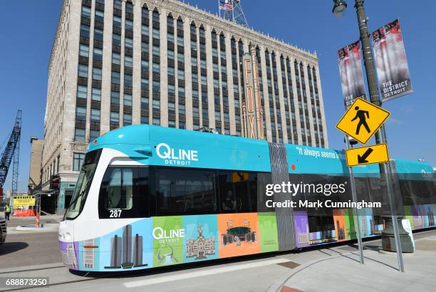 The QLine M-1 Rail streetcar moves down Woodward Ave. In front of the Fox Theatre in Detroit prior to the MLB game between the Detroit Tigers and the...
