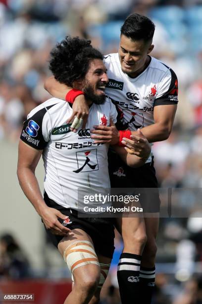 Sam Wykes of the Sunwolves celebrates with his team mate Yu Tamura of the Sunwolves after scoring a try during the Super Rugby Rd 14 match between...