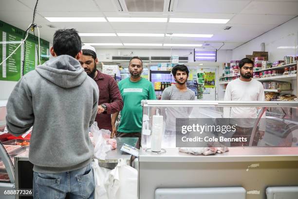 Shoppers line up in a Halal butchery to buy meat in preparation of breaking of the first fast of Ramadan in the south-western suburb of Lakemba, on...