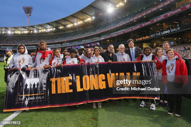 Gillon McLachlan, Opposition Leader Bill Shorten, Prime Minister Malcom Turnbull and his wife Lucy Turnbull join former Bombers legend Michael Long...
