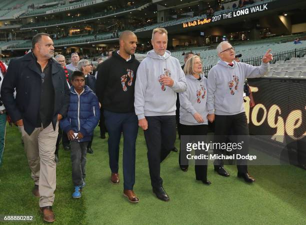 Opposition Leader Bill Shorten, Prime Minister Malcom Turnbull and his wife Lucy Turnbull join former Bombers legend Michael Long and Swans legend...