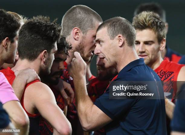 Demons head coach Simon Goodwin speaks to his players during the round ten AFL match between the Melbourne Demons and the Gold Coast Suns at Traeger...