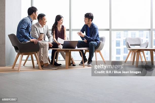 business people talking in meeting with a laptop - round table ストックフォトと画像
