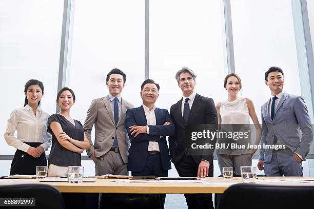 confident business people in meeting room - offener kragen stock-fotos und bilder