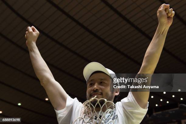 Yuta Tabuse of the Tochigi Brex cuts down the net after defeating the Kawasaki Brave Thunders in the the B. League final match between Kawasaki Brave...