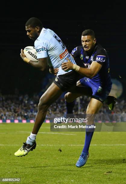 Edrick Lee of the Sharks takes a high ball ahead of Marcelo Montoya of the Bulldogs during the round 12 NRL match between the Cronulla Sharks and the...