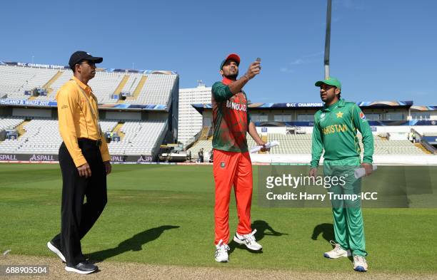 Mashrafe Mortaza, Captain of Bangladesh throws the coin as Sarfraz Ahmed, Captain of Pakistan looks on during the ICC Champions Trophy Warm-up match...