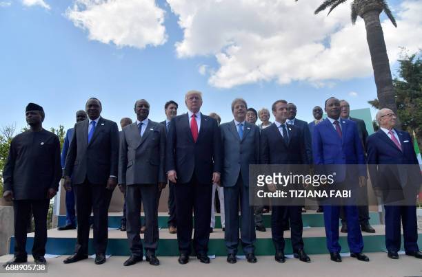 Leaders of the G7 and leaders of some African countries that have been invited for the two-day talks pose for a family photo on the second day of the...