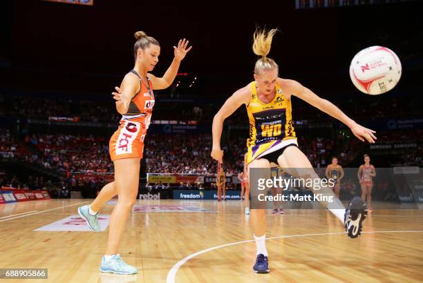Taylah Davies of the Giants competes with Laura Langman of the Lightning during the round 14 Super Netball match between the Giants and the Lightning...