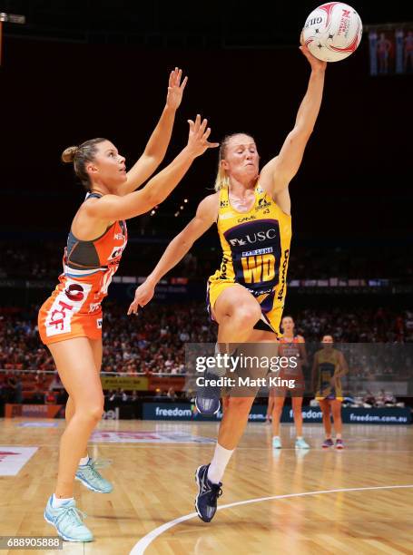 Taylah Davies of the Giants competes with Laura Langman of the Lightning during the round 14 Super Netball match between the Giants and the Lightning...