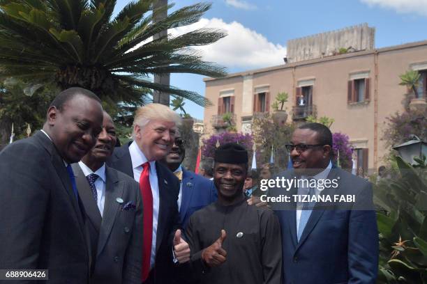 President Donald Trump poses with Kenya's President Uhuru Kenyatta , Guinea's President Alpha Conde , Vice President of Nigeria Yemi Osinbajo and...