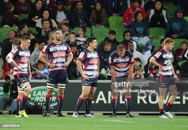 Captain Nic Stirzaker and the Rebels look dejected after the Crusaders scored a try during the round 14 Super Rugby match between the Rebels and the...