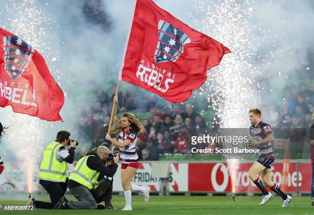 Captain Nic Stirzaker leads the Rebels onto the field during the round 14 Super Rugby match between the Rebels and the Crusaders at AAMI Park on May...