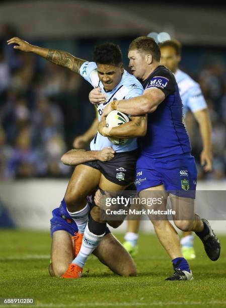 Sosaia Feki of the Sharks is tackled by Greg Eastwood of the Bulldogs during the round 12 NRL match between the Cronulla Sharks and the Canterbury...